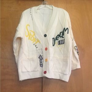Unique embroidered knit cream colored women’s cardigan.